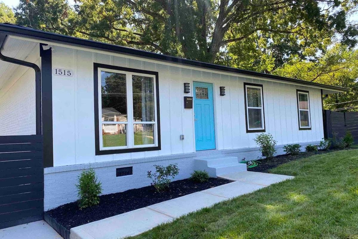 Newly renovated, modern home with a bright blue door in a quiet neighborhood 