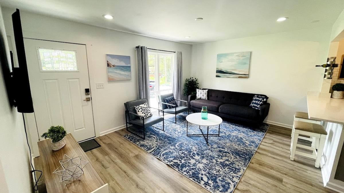 Spacious living room with ample seating and lots of natural sunlight. Flatscreen TV with streaming services available. The living room is perfect for gatherings and family movie nights.